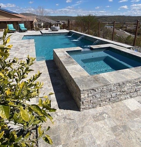 Custom Saturn Pools backyard pool in the Phoenix valley after a summer storm